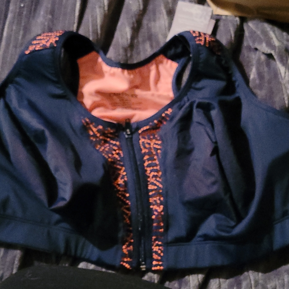 Sports bra. New with tags. Zipper front closure